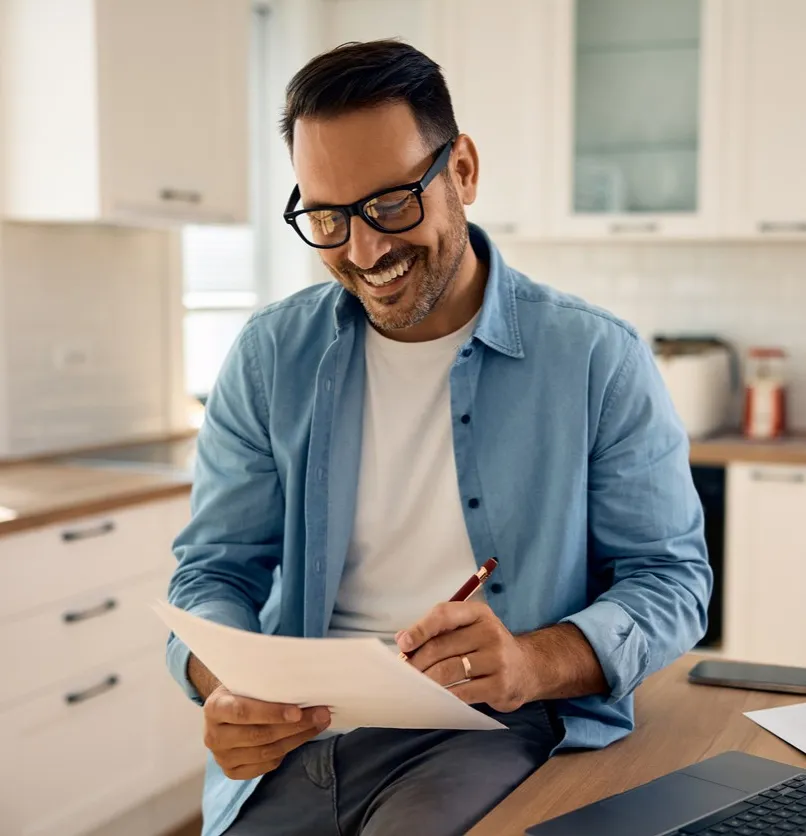 A man signing a piece of paper